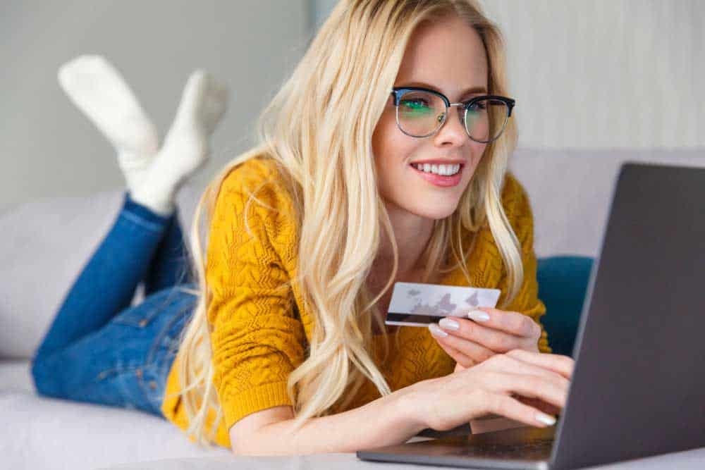 Woman paying with her credit card online