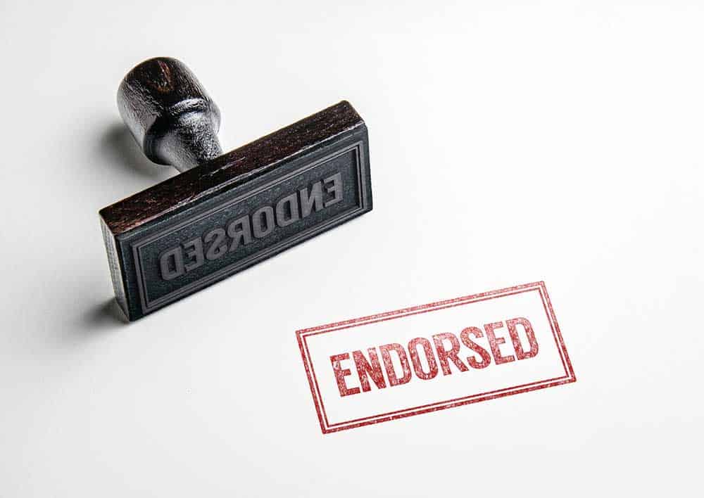 Rubber stamp with the word "Endorsed".