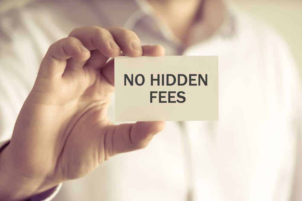 Businessman holding a small card saying "No hidden fees".