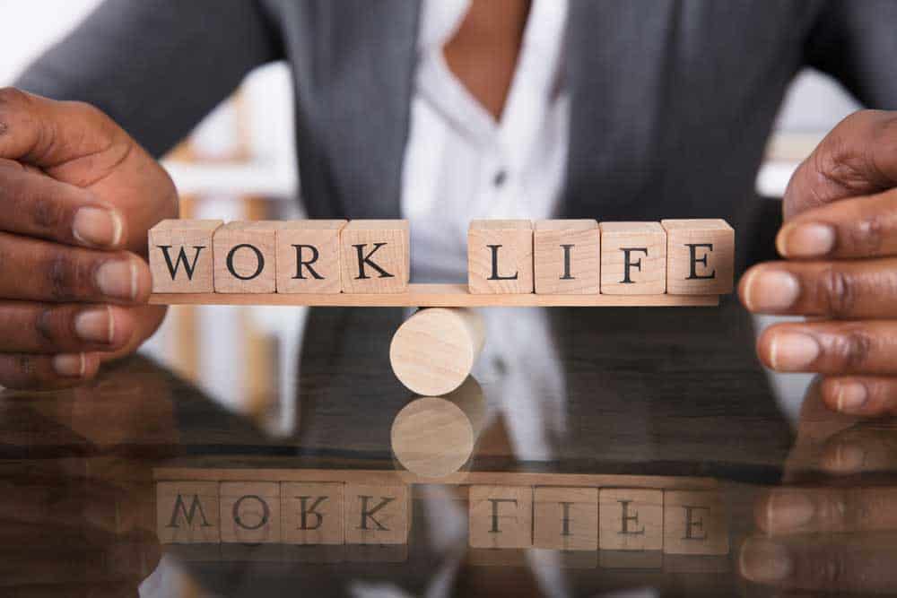 The words Work and Life balancing on a tilt.